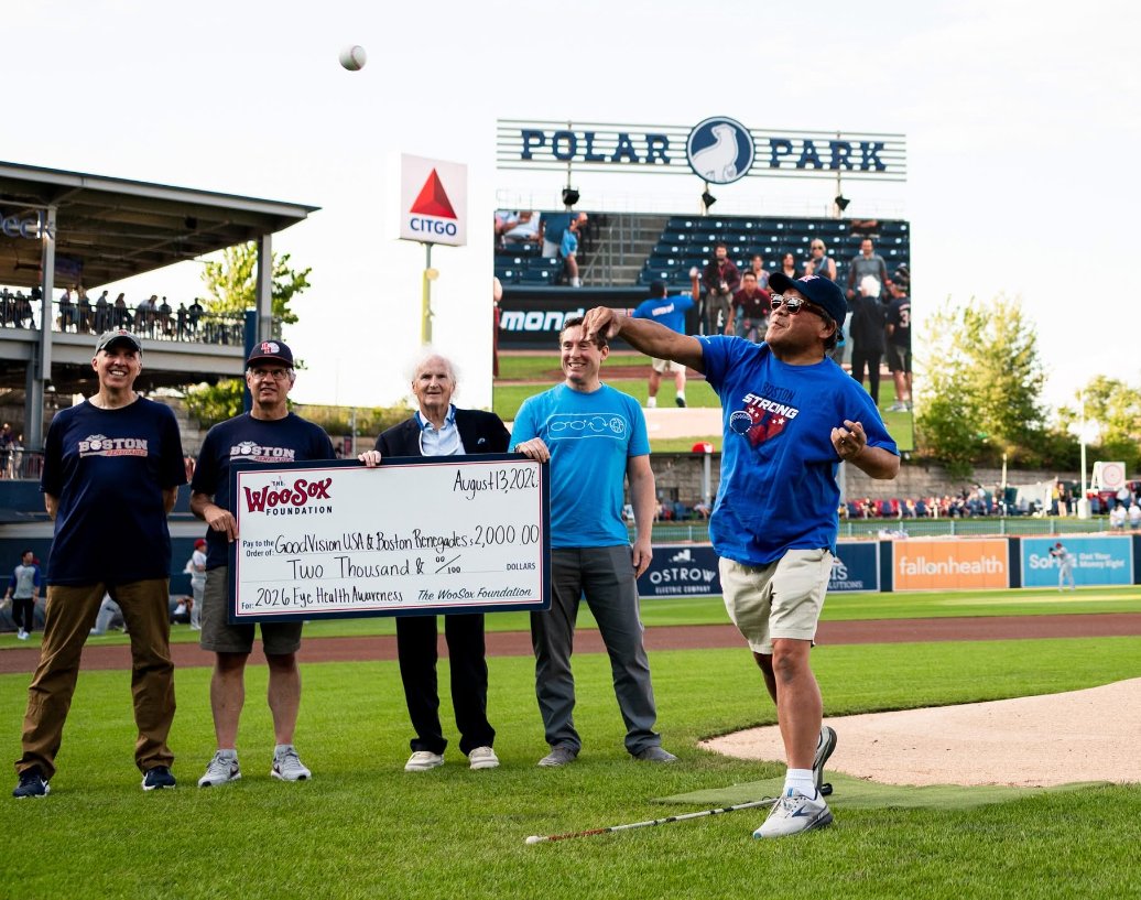 Blair Wong, 2025 International Optician of the Year, throws a ceremonial first pitch - a strike! - at the Eye Health Awareness Day game.